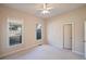 Bright bedroom with ceiling fan, neutral walls, and window coverings at 403 Pebblebrooke Ln, Canton, GA 30115