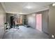 Basement home gym with a weight machine, treadmill, and exercise mats at 403 Pebblebrooke Ln, Canton, GA 30115