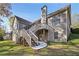 Two-story house with deck, stone accents, and landscaped yard at 403 Pebblebrooke Ln, Canton, GA 30115
