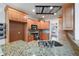 Kitchen with granite countertops, wooden cabinets, and stainless steel appliances at 403 Pebblebrooke Ln, Canton, GA 30115