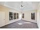 Main bedroom with trey ceiling, carpeting, and multiple windows at 403 Pebblebrooke Ln, Canton, GA 30115