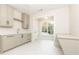 Modern laundry room with shaker cabinets, quartz countertops and a built-in desk at 6175 River Shore Pkwy, Atlanta, GA 30328