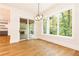 Bright dining room with hardwood floors and sliding glass doors to patio at 6175 River Shore Pkwy, Atlanta, GA 30328