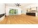 Open living room showcasing hardwood floors, fireplace, and access to backyard at 6175 River Shore Pkwy, Atlanta, GA 30328