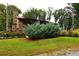 Stone house exterior with landscaping and American flag at 1625 Brushy Mountain Rd, Rockmart, GA 30153