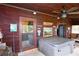Covered porch with hot tub and access to the home's interior at 1625 Brushy Mountain Rd, Rockmart, GA 30153