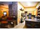 Open kitchen with stainless steel appliances and rustic wood cabinets at 1625 Brushy Mountain Rd, Rockmart, GA 30153