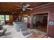 Screened porch with hot tub, ceiling fans, and access to living room at 1625 Brushy Mountain Rd, Rockmart, GA 30153