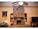 Large stone fireplace is a stunning focal point in this rustic living area at 1625 Brushy Mountain Rd, Rockmart, GA 30153