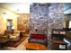 Cozy living area with stone walls, comfortable seating, and a wood stove at 1625 Brushy Mountain Rd, Rockmart, GA 30153