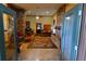 Spacious living room features a stone fireplace, comfy seating, and a large area rug at 1625 Brushy Mountain Rd, Rockmart, GA 30153