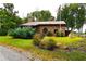 Stone house exterior with landscaping and American flag at 1625 Brushy Mountain Rd, Rockmart, GA 30153