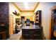 Rustic kitchen with stainless steel appliances and custom wood cabinets at 1625 Brushy Mountain Rd, Rockmart, GA 30153