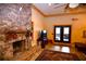 Impressive stone fireplace with a rustic wood mantel and built-in shelves at 1625 Brushy Mountain Rd, Rockmart, GA 30153