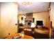 Spacious living area featuring a stone fireplace and a large TV at 1625 Brushy Mountain Rd, Rockmart, GA 30153
