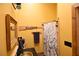 Modern bathroom with a shower and a rustic mirror at 1625 Brushy Mountain Rd, Rockmart, GA 30153
