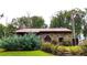 Rustic stone house exterior with a metal roof and landscaping at 1625 Brushy Mountain Rd, Rockmart, GA 30153