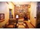 Relaxing living area with stone accent wall and comfortable leather recliners at 1625 Brushy Mountain Rd, Rockmart, GA 30153