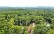 Cabin nestled in a large wooded area with mountain views in the distance at 1625 Brushy Mountain Rd, Rockmart, GA 30153
