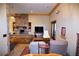 Cozy living room with stone fireplace and comfortable seating at 1625 Brushy Mountain Rd, Rockmart, GA 30153