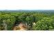 Aerial view of a cleared homesite with surrounding forest and distant mountains at 1625 Brushy Mountain Rd, Rockmart, GA 30153