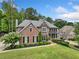 Two-story brick house with a large backyard and mature trees at 719 Settlers Xing, Canton, GA 30114