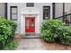 Welcoming building entrance with a red door and lush landscaping at 58 Peachtree Memorial Nw Dr # 1, Atlanta, GA 30309