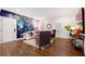 Living room with floral accent wall and hardwood floors at 58 Peachtree Memorial Nw Dr # 1, Atlanta, GA 30309