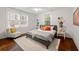 Bright bedroom with hardwood floors and a comfortable bed at 58 Peachtree Memorial Nw Dr # 1, Atlanta, GA 30309