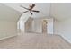 Large bonus room featuring a ceiling fan and access to other rooms at 1870 Rocksram Dr, Buford, GA 30519