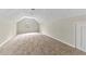 Spacious bonus room with neutral carpet and ample natural light at 1870 Rocksram Dr, Buford, GA 30519