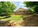 House back view, showcasing a deck and backyard at 1870 Rocksram Dr, Buford, GA 30519