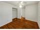 Hardwood floor bedroom with a large closet and ceiling fan at 741 Prince Ave, Marietta, GA 30062