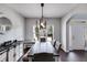 Farmhouse-style dining room with a rustic wooden table and bench seating at 200 Pine Trl, Dallas, GA 30157