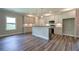 Modern kitchen with island, gray cabinets, and granite countertops at 111 Sunflower Ne Cir, Cartersville, GA 30121