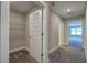 Hallway with carpet, doors to bedrooms and closet at 111 Sunflower Ne Cir, Cartersville, GA 30121