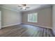 Spacious bedroom with ceiling fan and large window at 111 Sunflower Ne Cir, Cartersville, GA 30121