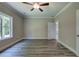 Bedroom with ceiling fan and access to hallway at 111 Sunflower Ne Cir, Cartersville, GA 30121