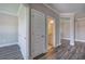 Gray vinyl flooring in a hallway with white doors and views into a bathroom and other rooms at 111 Sunflower Ne Cir, Cartersville, GA 30121