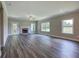 Large living room with hardwood floors, fireplace, and large windows at 111 Sunflower Ne Cir, Cartersville, GA 30121
