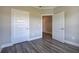 Gray vinyl flooring in a bedroom with white doors and views into another room at 111 Sunflower Ne Cir, Cartersville, GA 30121