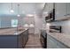 Modern kitchen with stainless steel appliances and granite countertops at 111 Sunflower Ne Cir, Cartersville, GA 30121