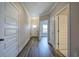 Gray vinyl flooring in a hallway with white doors and views into other rooms at 111 Sunflower Ne Cir, Cartersville, GA 30121