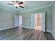 Primary bedroom with ceiling fan and en-suite bathroom at 111 Sunflower Ne Cir, Cartersville, GA 30121