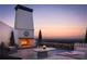 Relaxing rooftop terrace with fireplace and city views at 215 Mayfair Ct, Alpharetta, GA 30009