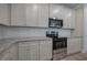 Modern kitchen with granite countertops and stainless steel appliances at 109 Sunflower Ne Cir, Cartersville, GA 30121