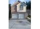 Two-story brick home with a two-car garage at 6258 Crooked Creek Dr, Rex, GA 30273