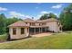 Stunning two-story house with a large screened porch and beautifully landscaped yard at 3135 Juhan Rd, Stone Mountain, GA 30087