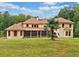 House exterior with a screened porch and landscaped yard at 3135 Juhan Rd, Stone Mountain, GA 30087