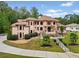 Large house with circular driveway and palm trees at 3135 Juhan Rd, Stone Mountain, GA 30087
